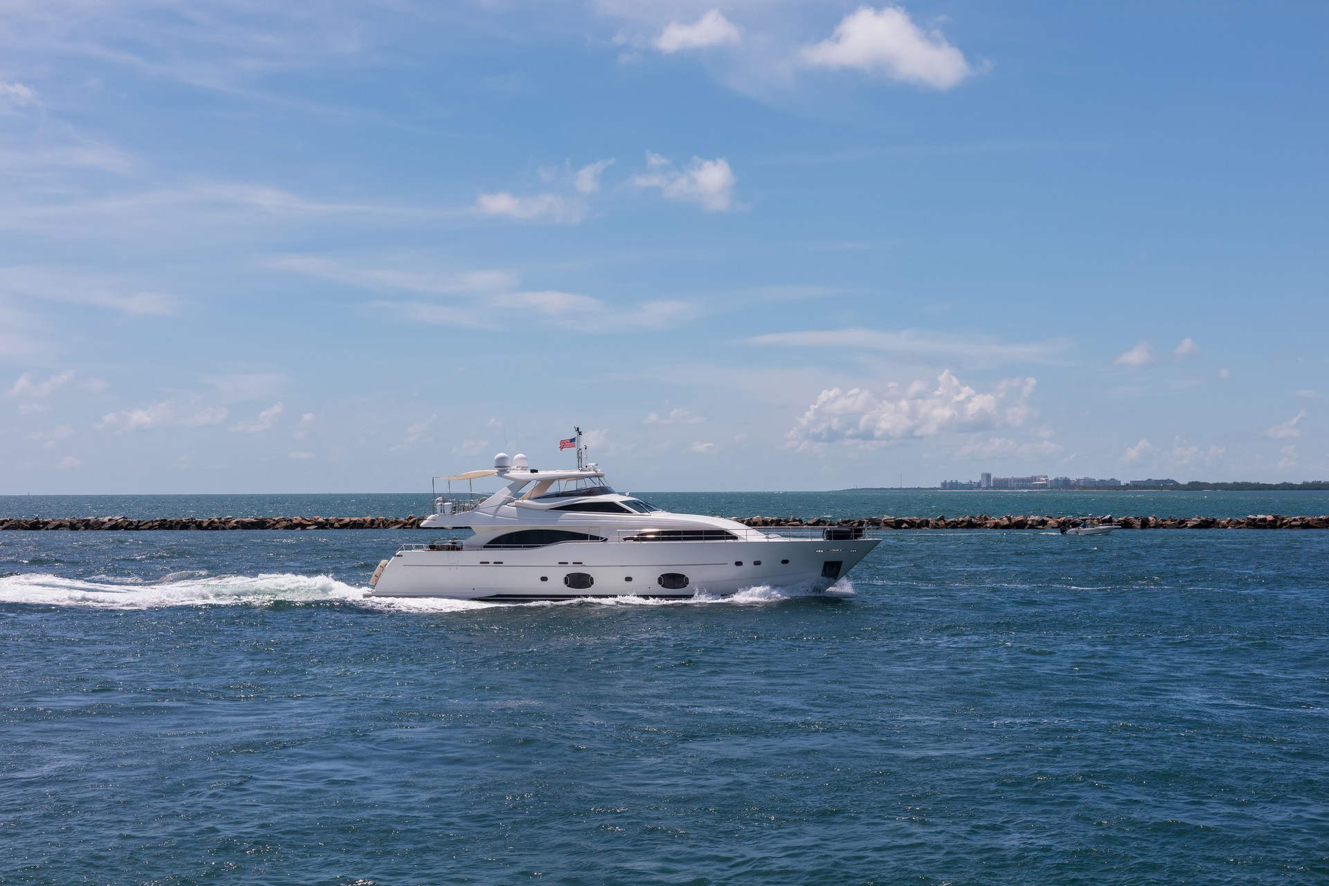 Luxury modern yacht, sailing in the ocean on a sunny day.